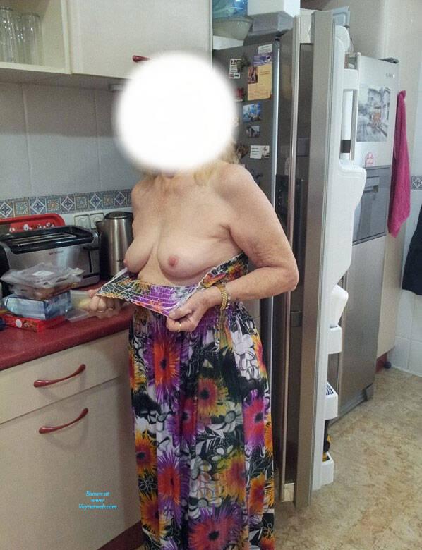 hot anonymous granny flashing a bit of her old tits picture 2